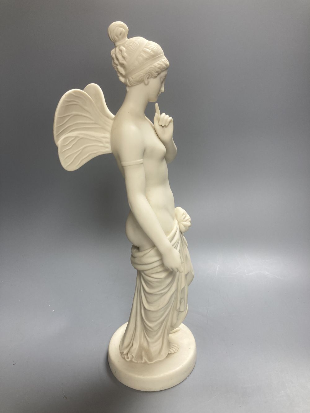 A Copeland Parian figure of a winged maiden and a later composition figure of Venus bathing, H 43cm
